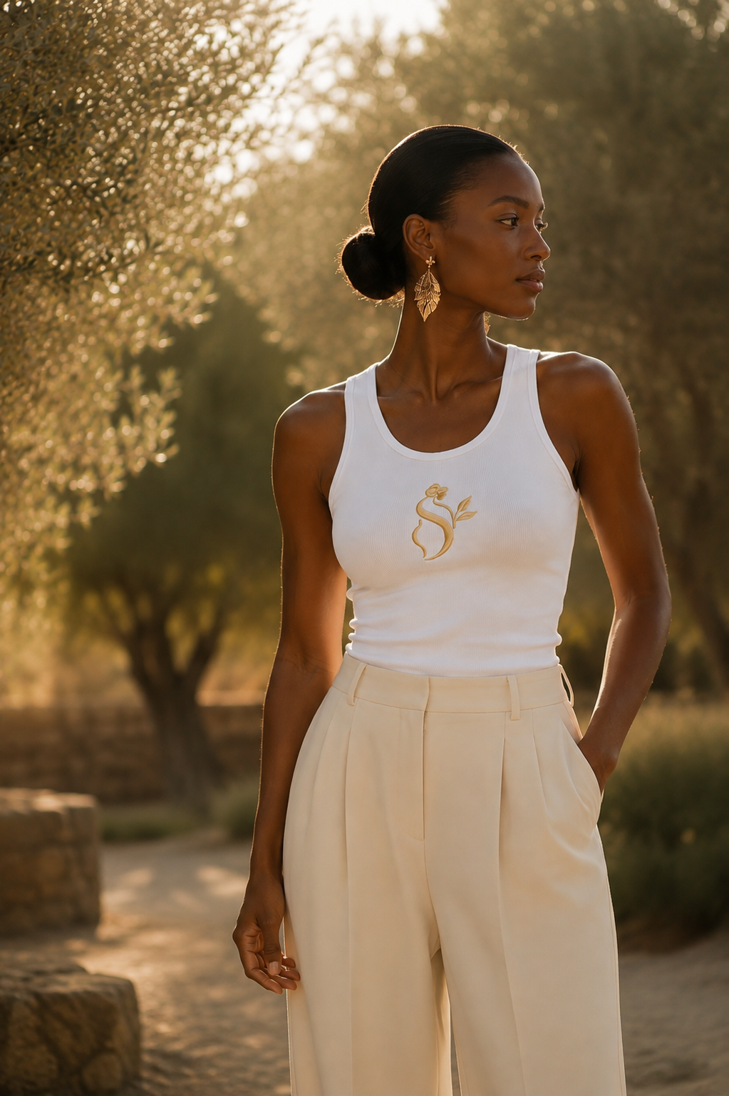 Softaholic campaign — woman in the signature white ribbed tank top at golden hour